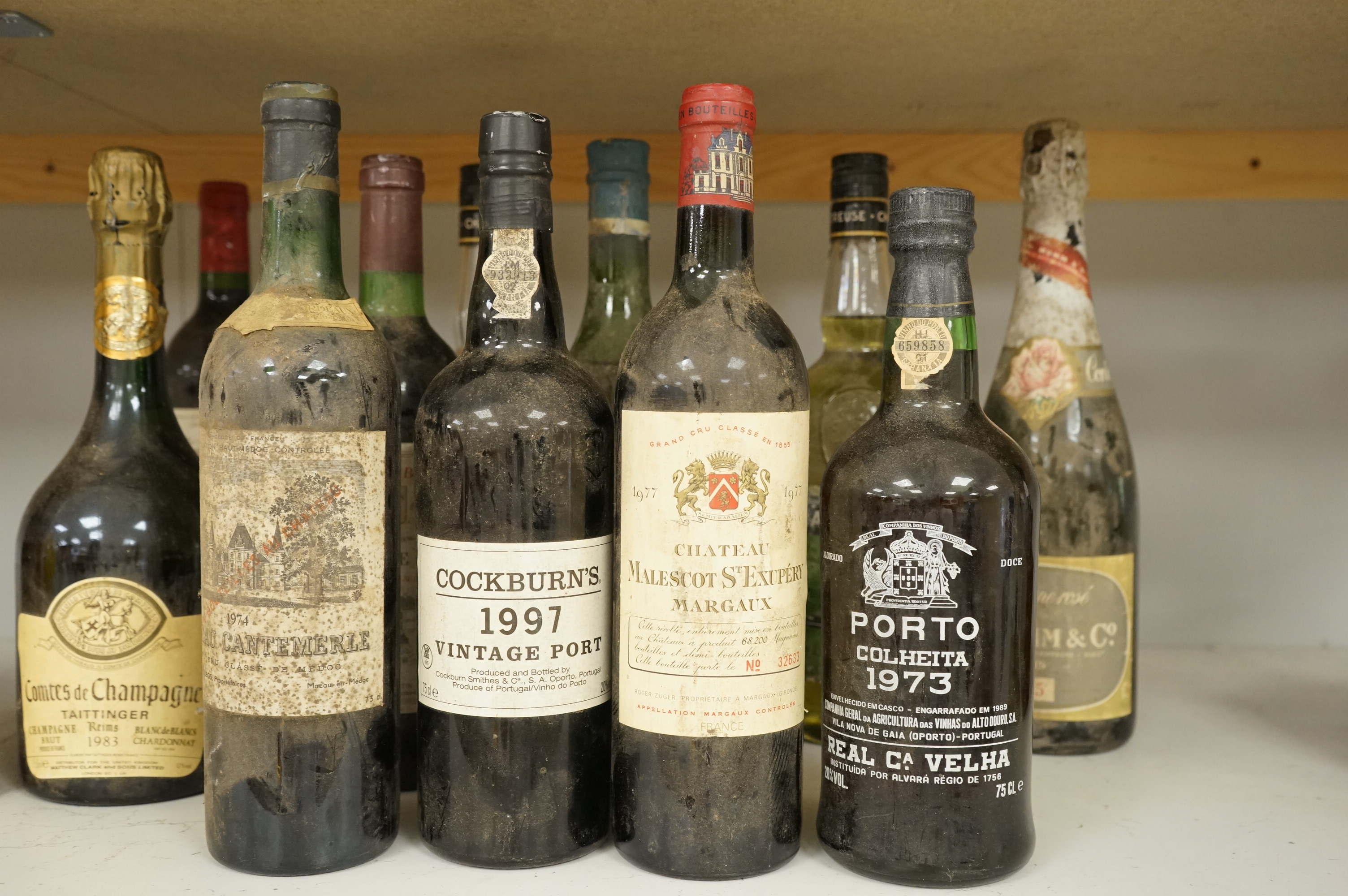 Eleven various bottles of port and wine to include; Cockburns 1997, Chateau Malescot St Exupéry Margaux, etc.